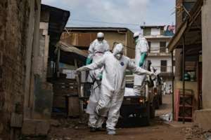 A Ugandan Red Cross worker during the evacuation of the body of a suspected Ebola victim in Kampala on May 26.  By Badru KATUMBA (AFP)