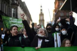 A variety of campaign groups braved the weather to protest in Glasgow.  By DANIEL LEAL-OLIVAS (AFP)