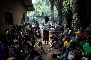 A volunteer brings daily food rations for a camp at Kikwit for people displaced by the bloody Kasai conflict