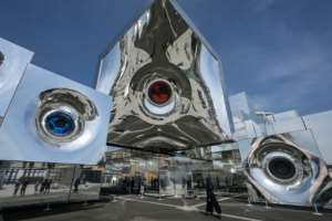 A woman (R) walks into the null pavilion at the 2025 Osaka Expo.  By Richard A. Brooks (AFP)