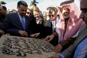 Abu Bakr Kenaan (2nd-R), the head of Sunni Muslim endowments in Nineveh province, places the cornerstone for the rebuilding of the Great Mosque of Al-Nuri and Al-Hadba leaning minaret in Mosul€s war-ravaged Old City, on December 16, 2018.  By Zaid AL-OBEIDI (AFP)