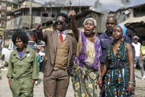 Activists Kasmuel McOure and Wanjira Wanjiru take their message to the Mathare slum.  By Tony KARUMBA (AFP)