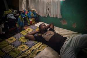 Albert Oppong, 30, who graduated but has not found a qualified job for the past five years, says hes sceptical of talk of a brighter future in Ghana.  By CRISTINA ALDEHUELA (AFP)