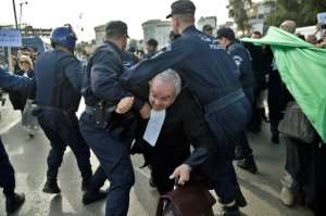 Algerian police disperse a protest by lawyers against ailing President Abdelaziz Bouteflika's bid for a fifth term in power. By RYAD KRAMDI (AFP)
