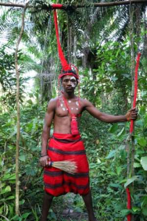 Alie Koroma of the Poro secret society in Matru stands guard at a forest site where initiation ceremonies are taking place.  By LYNN ROSSI (AFP)