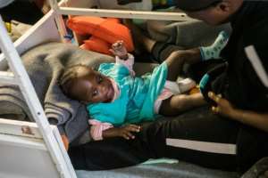 Among the 49 migrants trapped off the coast of Malta are a one-year-old baby and two children aged six and seven.  By FEDERICO SCOPPA (AFP)
