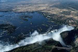 An aerial view of the Victoria Falls on the Zambezi River at the border between Zambia and Zimbabwe. Tourism accounts for around 10 percent of Zimbabwes GDP..  By Zinyange AUNTONY (AFP)