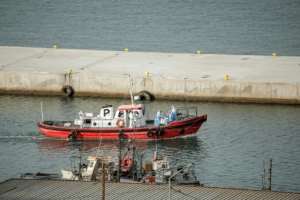 An ambulance boat sailed to the cruise ship.  By - (AFP)