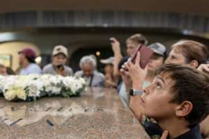 An attendee looks up at the light beam that shines through the roof of an Afrikaner memorial.  By Wikus de Wet (AFP)