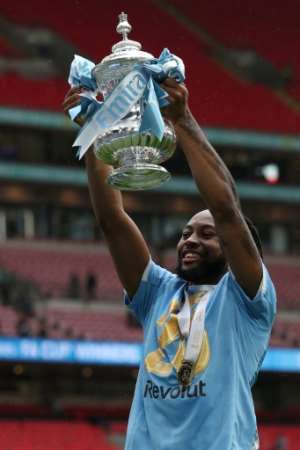 Antoine Semenyo holds aloft the FA Cup. His goal secured Manchester City a 1-0 win over Chelsea at Wembley.  By Adrian Dennis (AFP)