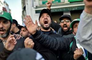Arabic and French hashtags including #FreeDemocraticAlgeria and#TheyMustAllResign have gone viral online, echoing chants in Algerias streets as protesters urge a boycott of the presidential poll.  By RYAD KRAMDI (AFP/File)