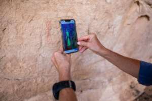 Archaeologists use a mobile phone application that helps to better detect the pigments in cave paintings. By Joris Bolomey (AFP)