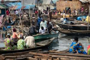 Armed Nigerian police patrolled during the demolition in the floating slum.  By TOYIN ADEDOKUN (AFP)