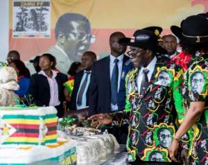 At his 93rd birthday celebrations in 2017, Mugabe struggled to walk unassisted and sat impassively in his seat through his birthday proceedings.  By Jekesai NJIKIZANA (AFP/File)