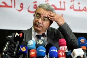Bar association chief Hatem Meziou speaks to reporters in the wake of the arrests.  By FETHI BELAID (AFP)