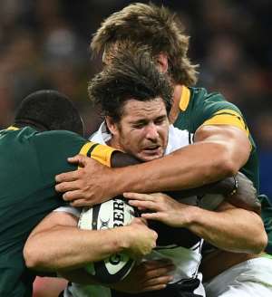 Barbarians Australian player Sam Carter is tackled during their Test match against South Africa at Wembley Stadium in London on November 5, 2016
