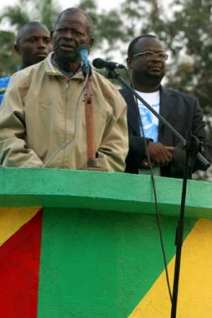 Bernard Kolelas, left, gives a speech in 2007 to support his son Guy-Brice Parfait Kolelas, a candidate in the legislative elections that year.  By Martin VAN DER BELEN (AFP)