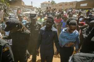Bobi Wine took part in the January 15 elections but is now in hiding.  By Rian COPE (AFP)