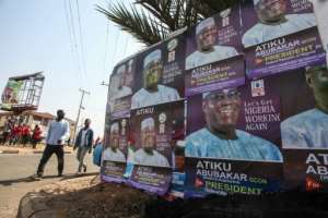 Buhari has also faced claims of interference in the judiciary after he suspended Nigerias top judge. Opposition candidate Abubakar, seen here in posters, accused him of attacking democracy.  By Sodiq ADELAKUN (AFP)