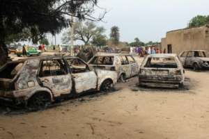 Burnout cars remain after a September 20 attack by Boko Haram on a market in Amarwa, near Borno state capital Maiduguri in northeast Nigeria.  By AUDU MARTE (AFP/File)