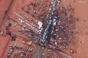 Buses carrying people fleeing Sudans unrest are seen at the Egyptian border in a satellite photo from April 28, 2023 and released by Maxar Technologies.  By - (Satellite image 2023 Maxar Technologies/AFP/File)