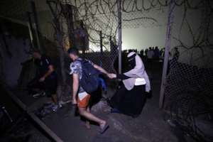 By Friday evening officials said more than 48,000 migrants had already returned.  By Abdel Majid BZIOUAT (AFP)