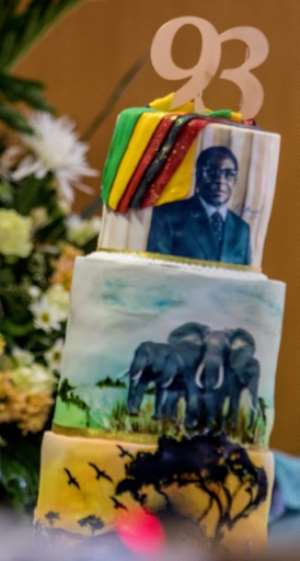Cake designs included his official Mercedes-Benz limousine, a crocodile, the national flag, his own head and the African continent.  By Jekesai NJIKIZANA (AFP/File)