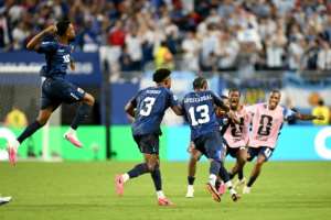 Cape Verde defender Sidney Lopes Cabral celebrates with teammates after scoring his teams second goal against Argentina in Miami.  By CHANDAN KHANNA (AFP)