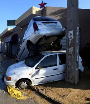 Cars are piled up following flash floods in the Tunisian town of Nabeul on September 23, 2018.  By FETHI BELAID (AFP)