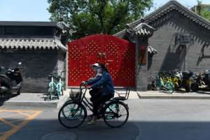 Close to 300,000 people have now died from the virus, which first emerged in China late last year.  By GREG BAKER (AFP)