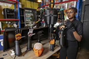 Co-founder and robotics engineer Norah Kimathi says they went through many different versions of their robotic arms.  By SIMON MAINA (AFP)