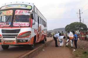 Crime scene: A suicide bomber was killed and several passengers were injured by a blast on a long-distance bus in Uganda.  By - (AFP)