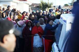 Crowds gathered outside as officials investigated.  By STR (AFP)