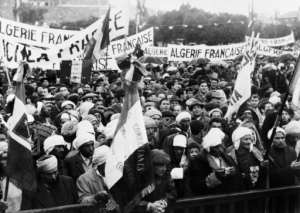 Crowds in Algeria in December 09, 1960 carry banners demanding that Algeria remains French during a visit by French President General Charles de Gaulle.  By - (AFP)