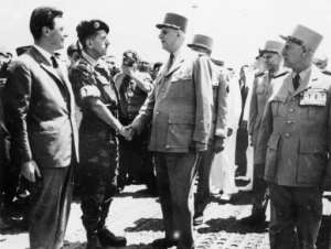 Dangerous game: French President General Charles de Gaulle (C) shakes hands with coup leader General Jacques Massu upon his arrival in Algiers in June 1958.  By STF (AFP/File)