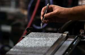 Designers created a font of thousands of hieroglyphs and cast them in lead, so they could be arranged line by line, covered in ink and printed onto paper.  By Ahmad HASSAN (AFP)