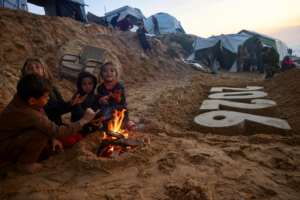 Displaced Palestinians prepare to usher in the New Year in Deir El-Balah in the central Gaza Strip.  By Bashar Taleb (AFP)