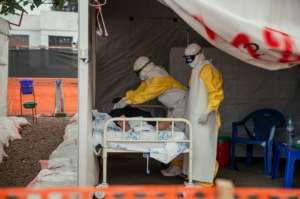 Doctors Without Borders (MSF) physicians move through the isolated red zone to monitor patients at an Ebola Treatment Center in Munigi, Congo.  By Jospin Mwisha (AFP)