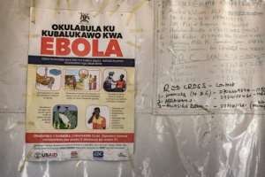Ebola emergency contact numbers posted at the Busunga border crossing between Uganda and the DRC.  By Badru Katumba (AFP)