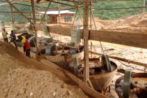 Employees at a Chinese mining company operate machinery at a mining site near Longa Mali