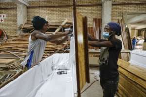 Enzo Wood is now working at maximum capacity, producing 300 coffins per day.  By Guillem Sartorio (AFP)