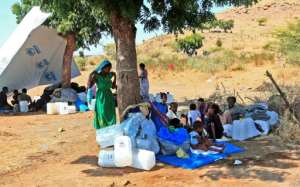 Ethiopian refugees who fled intense fighting in their homeland gather in Sudans Um Raquba camp.  By Ebrahim HAMID (AFP)