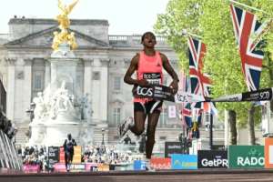 Ethiopias Tigst Assefa wins the London Marathon in a new womens-only world-record time.  By JUSTIN TALLIS (AFP)