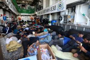 Evacuees rest on the Saudi Arabian warship HMS Al-Diriyah, transporting them from Port Sudan to Jeddah.  By Fayez NURELDINE (AFP)
