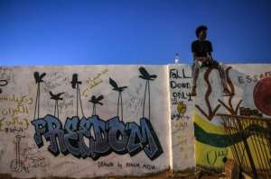 Even as Sudanese graffiti artists enjoy their first stroke of freedom, they all complain of a shortage of materials. By OZAN KOSE (AFP/File)