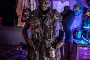 Fashion designer Pius Ochieng wears one of his dystopian inspired pieces.  By LUIS TATO (AFP)