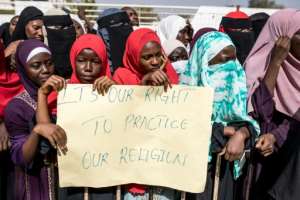 FGM supporters have demonstrated outside the National Assembly in Banjul.  By MUHAMADOU BITTAYE (AFP/File)