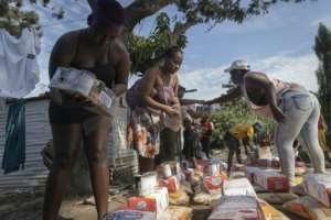 Food is handed out to people whoe lost their homes in Durbans devastating floods.  By Guillem SARTORIO (AFP)