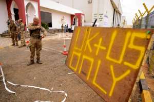 Foreign military personnel at Wadi Seidna Air Base, north of Khartoum in Sudan on April 30, 2023, as the last evacuees and military personnel prepared to leave, bound for Cyprus.  By Arron Hoare (Royal Navy/AFP)