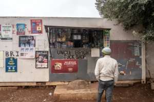 Foreigners running spaza shops are vulnerable to protection fee extortion.  By Shiraaz MOHAMED (AFP)